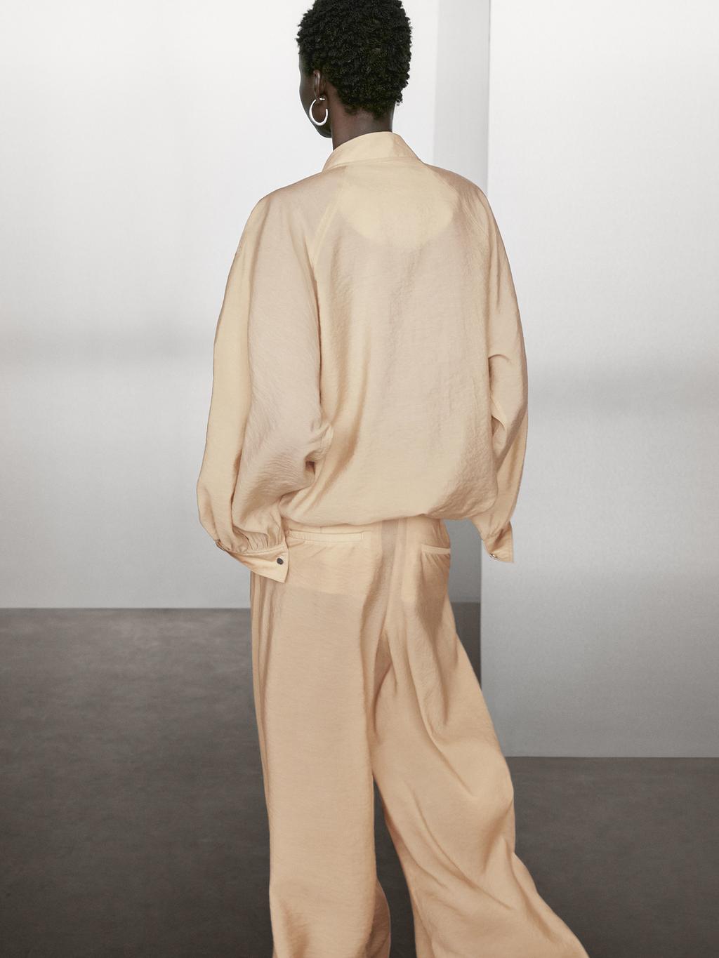 Loose-fitting bomber jacket with drawstring detail